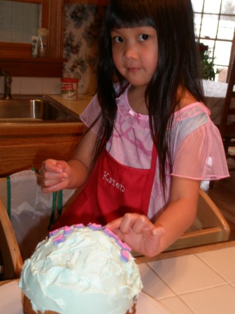 Kasen decorating her birthday cake